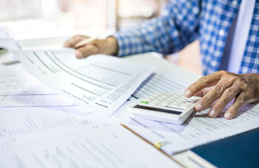 Asian man doing online business calculate income and expenses from purchase order, checking...