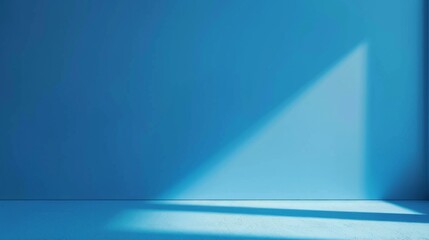 Blue wall with shadow of a triangle, abstract minimalism.