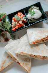 Chicken quessadilla with tomato salsa and avocado guacamole