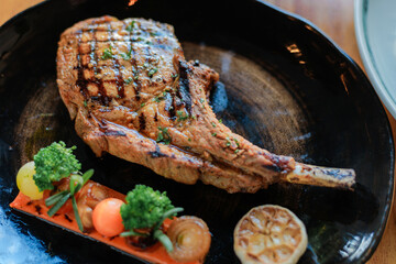 Fried pork chops with vegetables sauce and herbs