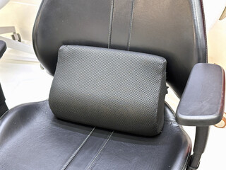Cushion for supporting the back when sitting in a chair to reduce back pain.