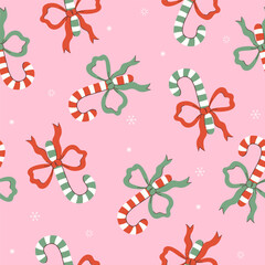 Seamless pattern with sweet canes with bows. Vector graphics.