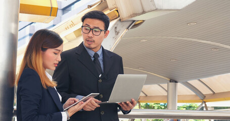 Business Partner using digital tablet online meeting team Partnership businessman, businesswoman talking together. Diversity Asian Business Partner online meeting trust teamwork. Asian Business team