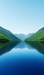 A serene lake surrounded by lush green mountains under a clear blue sky during the early hours of the morning