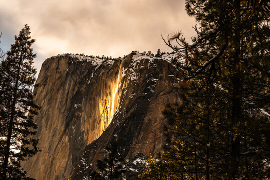 osemite's Firefall glowing at sunset, highlighting El Capitan's