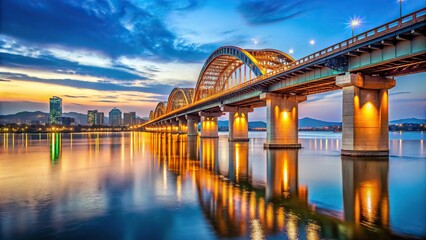 Naklejka premium Wide-angle view of Banghwa Bridge crossing the Han River in Seoul with cityscape in the background