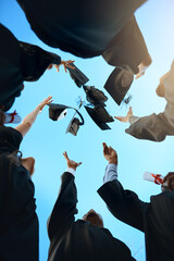 Below, people and throw graduation cap for celebration, education achievement and diploma success....