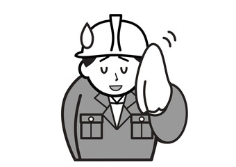 汗を拭く作業服姿の男性