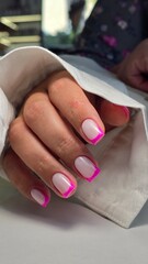 The beauty of the natural nails. Perfect clean manicure. New trendy nail arts on young women hand. Beautiful nail polish in hand