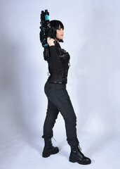 Full length portrait of beautiful black female model with short black hair wearing sci fi...