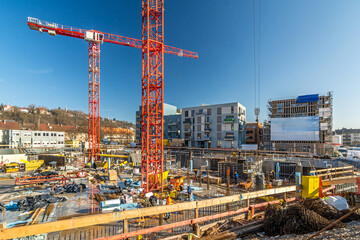 Large construction site with cranes and foundations