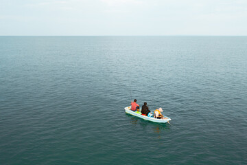 Tranquil Scene of a Small Boat on Open Water in Cambodia
