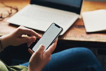Hands, smartphone and screen with mockup for project, blog or article in home office. Journalist, cellphone and social media for remote work, planning or research for copywriting freelance career