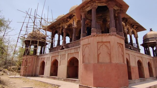 Footage of Battis Khamba Chhatri at Ranthambore Fort shot during daylight against blue sky
