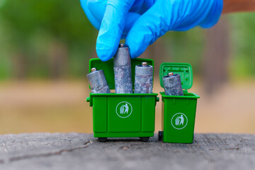 Ecological Focus On Safe Battery Disposal In Recycling Bin