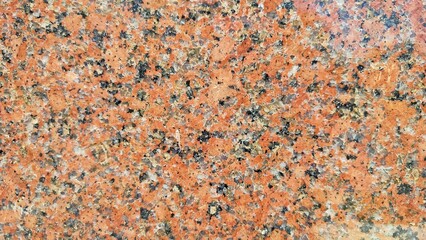 Red granite stone surface texture. Architecture detail background. Granite Texture, Red Base with Black and Gray Spots