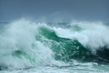 The huge splashing breaking wave of a stormy sea. Lewis and Harris, Outer Hebrides, Scotland. High quality photo