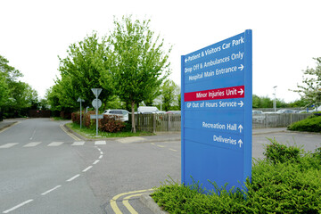 Typical NHS styled information sign seen adjacent to an outpatient car park in a British hospital....