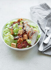 A bowl  of  Caesar salad