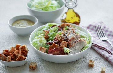 A bowl  of  Caesar salad