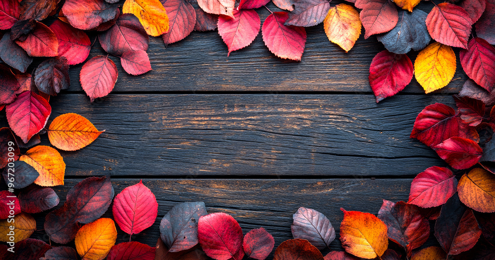 Poster a wooden frame with a red and yellow leaf border. the frame is made of wood and has a rustic feel. t