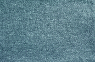 Natural fabric texture background. Simple and basic pattern textile. Indigo blue colored cloth surface closeup.