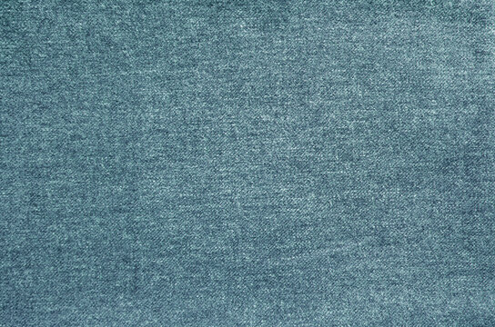 Natural fabric texture background. Simple and basic pattern textile. Indigo blue colored cloth surface closeup.