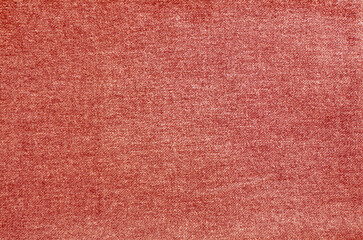 Natural fabric texture background. Simple and basic pattern textile. Tanned red colored cloth surface closeup.