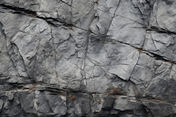 Fototapeta premium Processed collage of grey mountain cliff rock stone surface texture. Background for banner