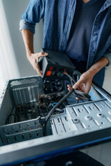 Computer repair technician specialist repairing and testing on Pc