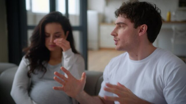 Pregnant couple medical insurance health problem at home man guy angry negative mad furious shouting conflict dissatisfied go away unwanted pregnancy male father woman girl female mother cry suffer