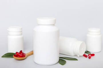 different drugs and health supplement pills with medicine bottle health care and medical top view. Vitamin tablets. Bottle with colored pills on table background. Multivitamins