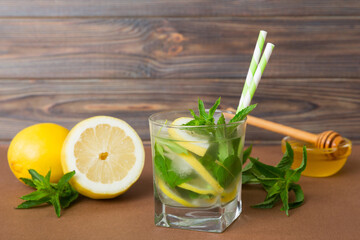 Mojito cocktail. Refreshing mojito cocktail with lime, lemon and mint in a tall glass with a stick