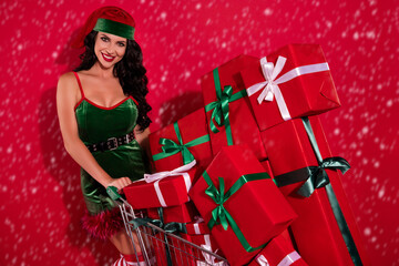 Photo of classy gorgeous young santa helper wear elf dress buying new year gifts smiling isolated...