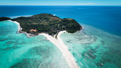 Aerial view of Nosy Iranja Island in Madagascar showcasing its picturesque white sand beach and vibrant turquoise waters