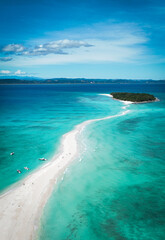 Aerial view of Nosy Iranja Island showcasing its pristine beach and turquoise waters in Madagascar under clear skies