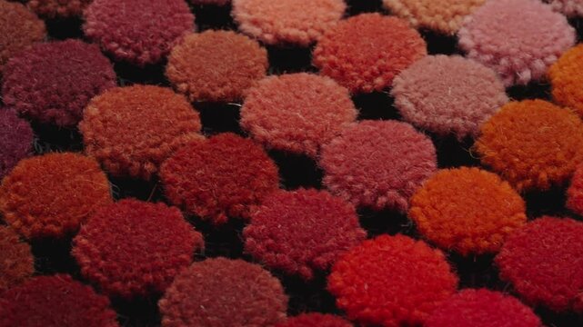 Collection of colorful carpet pile samples on tray moving in isometric view. Close up view. Textile industry concept.