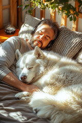 young man sleeps with his big husky on the sofa in the living room listening to music with headphones, husky warmth, winter, care, pets, peace, relax, vertical, trust,