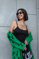 Fashionable beautiful glamorous urban lady smiling with vintage sunglasses in black stylish clothes...