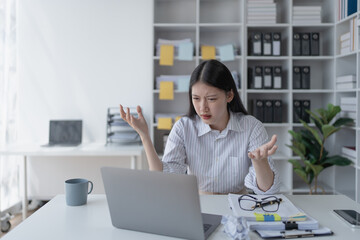 businesswoman plans a finance audit, reviewing documents while battling burnout syndrome.