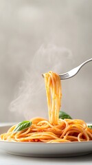 Delicious Spaghetti Twirled with Tomato Sauce and Fresh Basil - Elegant Fork Handling Steaming Pasta Against a Light Background Perfect for Food Lovers and Culinary Designs
