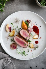 Meticulously arranged sous-vide duck breast with pear compote on a white plate, showcasing modern...