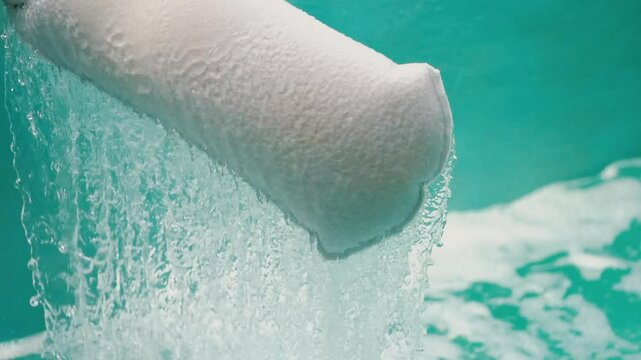 Water  from the water pump pipe.Slow motion water filtration