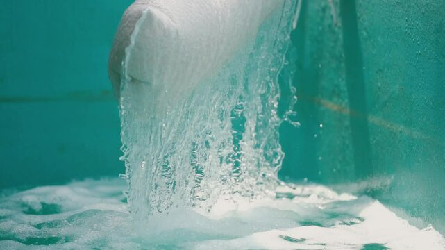 Water  from the water pump pipe.Slow motion water filtration