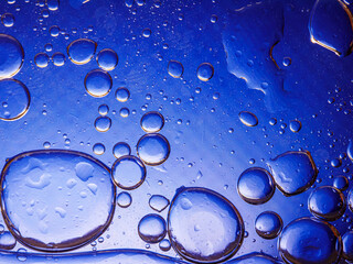 Bubbles on blue background. Abstract oxygen bubble water in sea sponge on blue background.Blue...