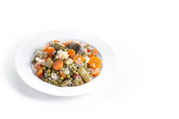 Vegetable stew (menestra de verduras) on a plate isolated on white background. Copy space