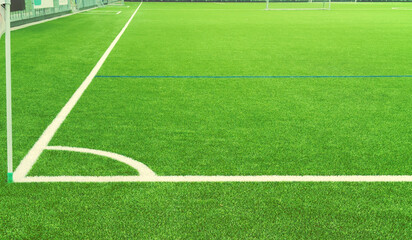Fragment of a football field. Football soccer field corner with white marks. White line drawn on a...