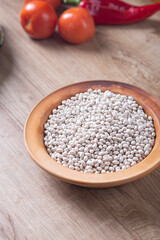 White beans on wooden table in kitchen