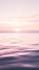 Obraz premium Calm Glassy Sea Water at Dawn with Soft Pink and Purple Reflections