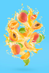 Apricot pieces with apricot juice, green leaves, drops, splashes, flows levitate on blue...
